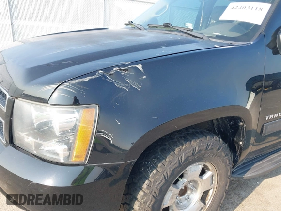 2014 Chevrolet Tahoe LT with VIN 1GNSCBE01ER235571, listed as a IAAI auction lot 42403118 with 238,069 mi miles and . Bid and sale history available at DreamBid. Image 17.