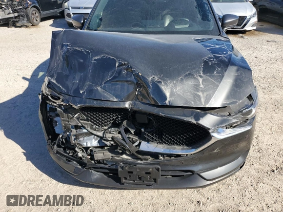 2021 Mazda CX-5 Signature with VIN JM3KFBEY2M0437304, listed as a Copart auction lot 88841415 with 57,100 mi miles and Salvage Title. Bid and sale history available at carsss.com. Image 12.