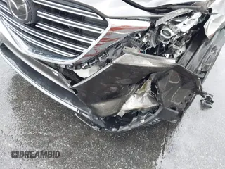 2016 Mazda CX-9 Grand Touring z VIN JM3TCADY6G0126391, wystawiony jako IAAI lot #42242541 z przebiegiem 45 147 mil mil oraz . Historia ofert i sprzedaży dostępna na DreamBid. Obrazek 17.