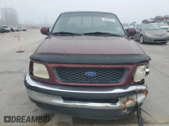 1997 Ford F-150 with VIN 2FTDX1726VCA74811, listed as a Copart auction lot 81909844 with 136,520 mi miles and Salvage title. Bid and sale history available at DreamBid. Image 5.