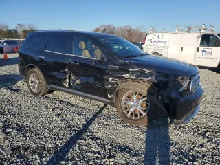 2015 Dodge Durango Citadel with VIN 1C4RDHEG2FC702604, listed as a Copart auction lot 82533594 with 135,798 mi miles and Salvage title. Bid and sale history available at DreamBid. Image 4.
