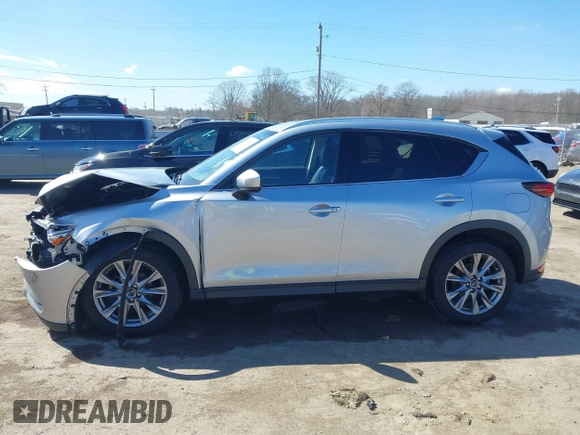 2021 Mazda CX-5 Grand Touring with VIN JM3KFBDM3M1300316, listed as a IAAI auction lot 41878520 with 77,670 mi miles and . Bid and sale history available at DreamBid. Image 14.