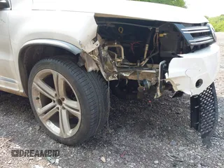 2014 Volkswagen Tiguan SEL with VIN WVGAV3AX7EW022239, listed as a IAAI auction lot 42381670 with 180,729 mi miles and . Bid and sale history available at DreamBid. Image 18.