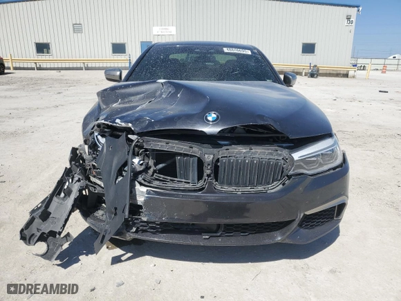 2018 BMW 5 Series M550i xDrive with VIN WBAJB9C5XJB049624, listed as a Copart auction lot 48846695 with 0 mi miles and Salvage Title. Bid and sale history available at carsss.com. Image 5.