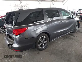 2019 Honda Odyssey Touring z VIN 5FNRL6H88KB037149, wystawiony jako IAAI lot #42356871 z przebiegiem 64 549 mil mil oraz . Historia ofert i sprzedaży dostępna na DreamBid. Obrazek 4.