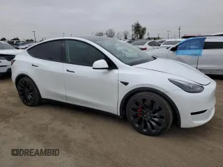 2022 Tesla Model Y Performance with VIN 7SAYGDEF1NF410241, listed as a Copart auction lot 55359505 with 42,652 mi miles and Salvage Title. Bid and sale history available at DreamBid. Image 4.