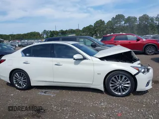 2019 Infiniti Q50 Luxe with VIN JN1EV7ARXKM557946, listed as a IAAI auction lot 40362058 with 56,615 mi miles and . Bid and sale history available at carsss.com. Image 13.