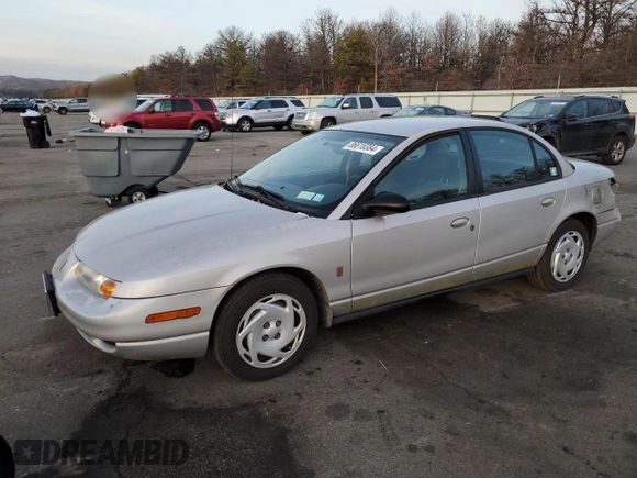 2001 Saturn SL z VIN 1G8ZK52761Z204012, wystawiony jako Copart lot #86618384 z przebiegiem 99 674 mil mil oraz Szkoda całkowita • Salvage title. Historia ofert i sprzedaży dostępna na DreamBid. Obrazek 1.