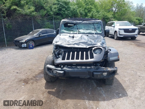 2021 Jeep Gladiator Freedom with VIN 1C6HJTAG3ML557932, listed as a IAAI auction lot 42150245 with 26,656 mi miles and . Bid and sale history available at DreamBid. Image 13.