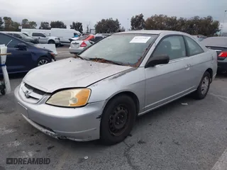 2002 Honda Civic LX with VIN 1HGEM22532L024309, listed as a IAAI auction lot 41777543 with 202,512 mi miles. Bid and sale history available at carsss.com. Image 2.