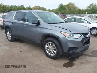 2019 Chevrolet Traverse LS z VIN 1GNERFKW5KJ283936, wystawiony jako IAAI lot #42238519 z przebiegiem 75 851 mil mil oraz . Historia ofert i sprzedaży dostępna na DreamBid. Obrazek 1.