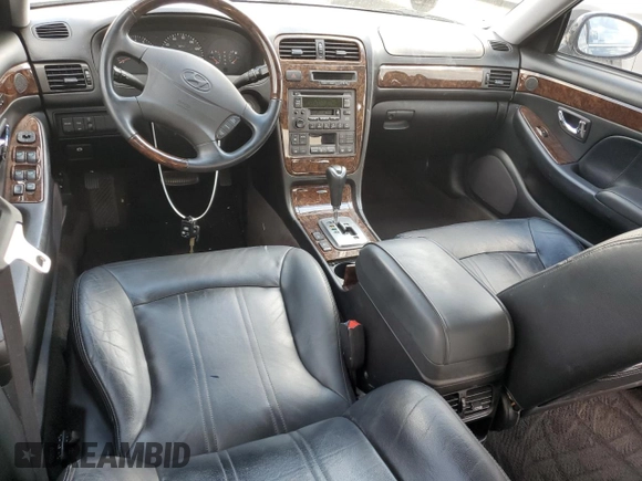 2003 Hyundai XG z VIN KMHFU45E63A237497, wystawiony jako Copart lot #74299524 z przebiegiem Nie podano mil oraz Szkody całkowita. Historia ofert i sprzedaży dostępna na DreamBid. Obrazek 8.