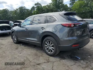 2019 Mazda CX-9 Touring with VIN JM3TCACY6K0334121, listed as a Copart auction lot 64901735 with 112,328 mi miles and Salvage title. Bid and sale history available at DreamBid. Image 2.