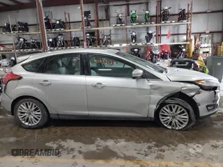 2018 Ford Focus Titanium with VIN 1FADP3N25JL261736, listed as a IAAI auction lot 41032128 with 59,142 mi miles and . Bid and sale history available at DreamBid. Image 13.