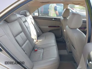2002 Toyota Camry XLE z VIN 4T1BF30K02U001246, wystawiony jako IAAI lot #42334251 z przebiegiem 58 575 mil mil oraz . Historia ofert i sprzedaży dostępna na DreamBid. Obrazek 8.