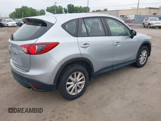 2016 Mazda CX-5 Sport z VIN JM3KE4BY1G0711602, wystawiony jako IAAI lot #42537627 z przebiegiem Nie podano mil oraz . Historia ofert i sprzedaży dostępna na DreamBid. Obrazek 4.