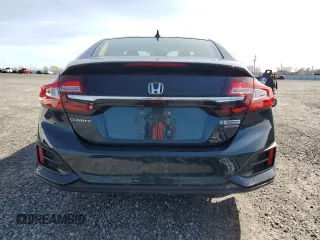 2018 Honda Clarity Touring z VIN JHMZC5F35JC800286, wystawiony jako Copart lot #55320545 z przebiegiem 122 548 mil mil oraz Czysty tytuł • Clean title. Historia ofert i sprzedaży dostępna na DreamBid. Obrazek 6.