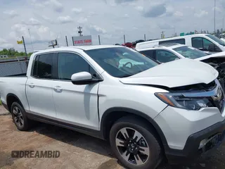 2020 Honda Ridgeline RTL with VIN 5FPYK3F51LB029859, listed as a IAAI auction lot 42462285 with 57,399 mi miles and . Bid and sale history available at DreamBid. Image 14.