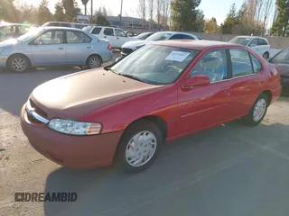 2001 Nissan Altima GXE with VIN 1N4DL01DX1C166896, listed as a IAAI auction lot 41335212 with 163,236 mi miles. Bid and sale history available at carsss.com. Image 2.