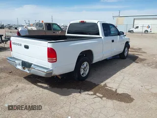 1999 Dodge Dakota SLT with VIN 1B7GL22X6XS186007, listed as a IAAI auction lot 41953254 with 322,541 mi miles. Bid and sale history available at carsss.com. Image 4.