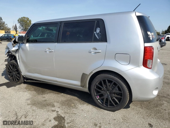 2012 Scion xB with VIN JTLZE4FE3C1143496, listed as a Copart auction lot 52157215 with 223,376 mi miles and Salvage Title. Bid and sale history available at carsss.com. Image 2.