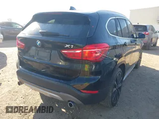 2018 BMW X1 sDrive28i with VIN WBXHU7C30J5L04913, listed as a IAAI auction lot 41755344 with 101,867 mi miles. Bid and sale history available at carsss.com. Image 4.