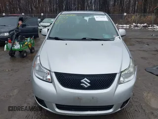 2011 Suzuki SX4 with VIN JS2YC5A41B6300385, listed as a IAAI auction lot 41570810 with 117,847 mi miles and . Bid and sale history available at DreamBid. Image 12.