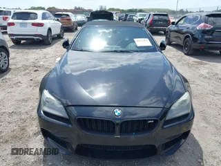 2014 BMW M6 z VIN WBSLZ9C52EDZ78748, wystawiony jako IAAI lot #42152435 z przebiegiem 57 150 mil mil oraz . Historia ofert i sprzedaży dostępna na DreamBid. Obrazek 6.