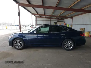2015 Infiniti Q70 z VIN JN1BY1AP9FM542429, wystawiony jako IAAI lot #41903214 z przebiegiem 139 255 mil mil oraz . Historia ofert i sprzedaży dostępna na DreamBid. Obrazek 14.
