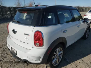 2014 MINI Countryman S z VIN WMWZC5C57EWP38396, wystawiony jako IAAI lot #41027727 z przebiegiem 147 260 mil mil oraz . Historia ofert i sprzedaży dostępna na DreamBid. Obrazek 4.