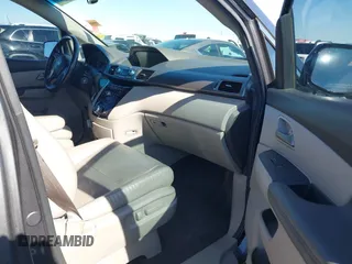 2012 Honda Odyssey EX-L with VIN 5FNRL5H64CB044075, listed as a IAAI auction lot 42094680 with 67,165 mi miles and . Bid and sale history available at carsss.com. Image 5.