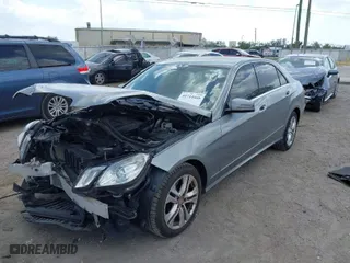 2011 Mercedes-Benz E-Class E 350 Luxury with VIN WDDHF8HB2BA354708, listed as a IAAI auction lot 41714460 with 143,590 mi miles. Bid and sale history available at carsss.com. Image 2.