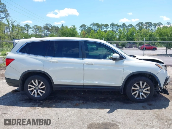 2019 Honda Pilot EX-L with VIN 5FNYF5H42KB026108, listed as a IAAI auction lot 42387593 with 112,556 mi miles and . Bid and sale history available at DreamBid. Image 13.