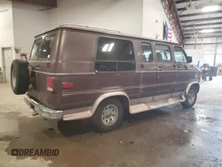 1992 Chevrolet Chevy Van z VIN 2GBEG25K3N4150299, wystawiony jako Copart lot #74099444 z przebiegiem 156 341 mil mil oraz Tytuł czysty. Historia ofert i sprzedaży dostępna na DreamBid. Obrazek 3.