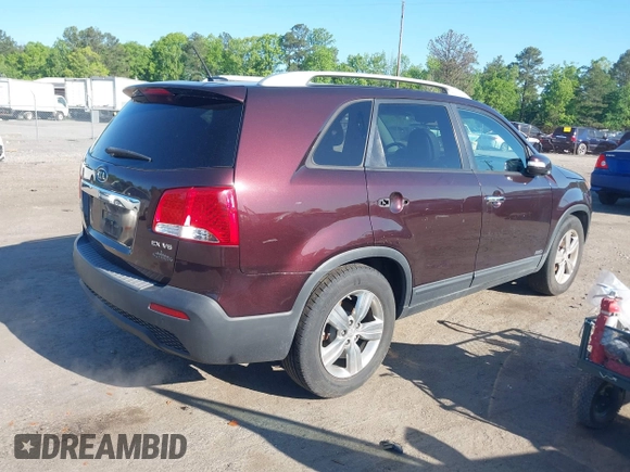 2012 Kia Sorento EX with VIN 5XYKUDA23CG206609, listed as a IAAI auction lot 42142072 with 162,574 mi miles. Bid and sale history available at carsss.com. Image 4.