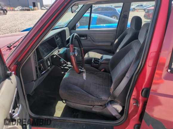 1996 Jeep Cherokee Sport with VIN 1J4FJ68S6TL171056, listed as a Copart auction lot 52099555 with 250,089 mi miles and Salvage Title. Bid and sale history available at carsss.com. Image 7.