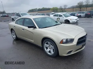 2013 Dodge Charger Police with VIN 2C3CDXAT9DH692946, listed as a IAAI auction lot 42115225 with 107,086 mi miles. Bid and sale history available at carsss.com. Image 1.