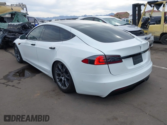 2021 Tesla Model S Long Range with VIN 5YJSA1E57MF453815, listed as a IAAI auction lot 41818700 with 51,176 mi miles and . Bid and sale history available at DreamBid. Image 3.