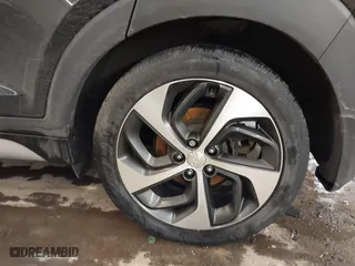 2018 Hyundai Tucson Value with VIN KM8J3CA28JU648236, listed as a IAAI auction lot 41161221 with 104,057 mi miles. Bid and sale history available at carsss.com. Image 12.