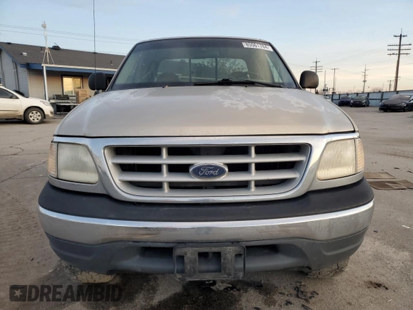 1999 Ford F-150 z VIN 2FTRX18W3XCA06671, wystawiony jako Copart lot #85561784 z przebiegiem 100 579 mil mil oraz Szkoda całkowita • Salvage title. Historia ofert i sprzedaży dostępna na DreamBid. Obrazek 5.