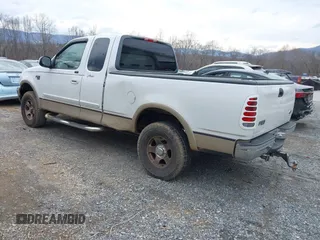 1999 Ford F-150 XL with VIN 1FTRX18LXXKA75357, listed as a IAAI auction lot 41630371 with 202,021 mi miles. Bid and sale history available at carsss.com. Image 3.