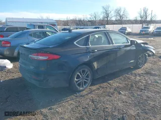2020 Ford Fusion Hybrid Titanium with VIN 3FA6P0RU9LR141476, listed as a IAAI auction lot 41472921 with 84,433 mi miles. Bid and sale history available at carsss.com. Image 4.