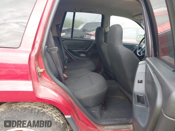 2004 Jeep Grand Cherokee Laredo with VIN 1J4GW48S64C371253, listed as a IAAI auction lot 42099607 with 260,618 mi miles. Bid and sale history available at carsss.com. Image 8.