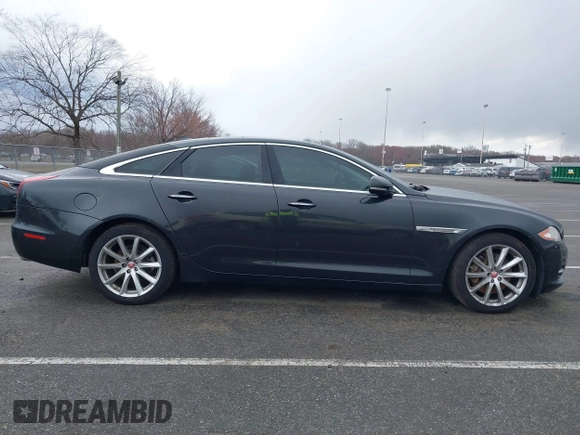 2014 Jaguar XJ with VIN SAJWA1CZ0E8V73966, listed as a IAAI auction lot 41887234 with 120,804 mi miles and . Bid and sale history available at DreamBid. Image 13.
