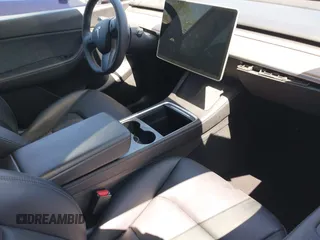 2022 Tesla Model Y Performance with VIN 7SAYGDEFXNF513951, listed as a IAAI auction lot 41986001 with 37,225 mi miles and . Bid and sale history available at DreamBid. Image 5.