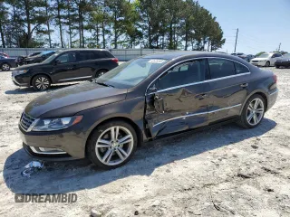 2013 Volkswagen CC Lux with VIN WVWRN7AN4DE546711, listed as a Copart auction lot 52673205 with 106,700 mi miles and Salvage Title. Bid and sale history available at DreamBid. Image 1.