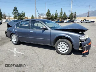 1999 Nissan Maxima GXE z VIN JN1CA21D9XM409448, wystawiony jako Copart lot #51822895 z przebiegiem Nie podano mil oraz Szkoda całkowita • Salvage title. Historia ofert i sprzedaży dostępna na DreamBid. Obrazek 4.