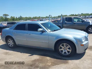 2006 Chrysler 300 Touring with VIN 2C3KA53G56H324954, listed as a IAAI auction lot 42058478 with 124,933 mi miles. Bid and sale history available at carsss.com. Image 13.