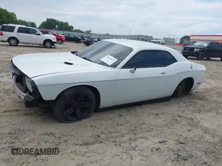 2013 Dodge Challenger SXT с VIN 2C3CDYAG0DH607372, выставлен на аукционе IAAI как лот 42819112 с пробегом 223 376 миль миль и . История ставок и продаж доступна на DreamBid. Изображение 14.