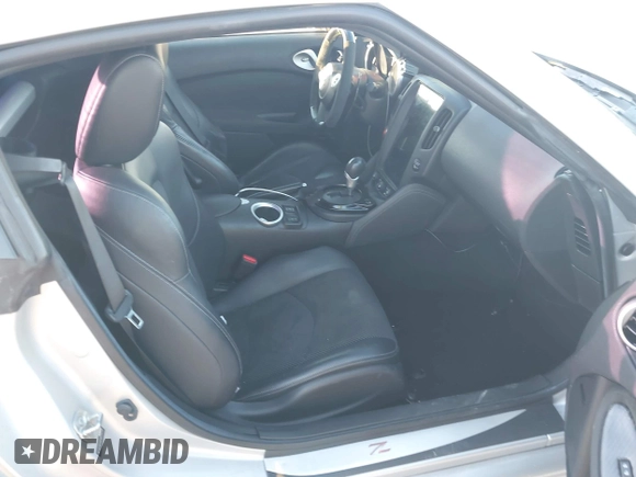 2014 Nissan 370Z Nismo with VIN JN1AZ4EH4EM634236, listed as a IAAI auction lot 41256664 with 80,294 mi miles and . Bid and sale history available at DreamBid. Image 5.